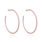 Boucles d'oreilles créoles rhodiées, rosées ou dorées, serties zirconiums, en Argent - 925/000. Les créoles, véritables accessoires de mode intemporels, ajoutent une touche d'élégance à n'importe quelle tenue. CARACTERISTIQUES : Poids (gr) : 9.70 Diamètre (cm): 6.00 Matière : Argent - 925/000 19898 - 20463