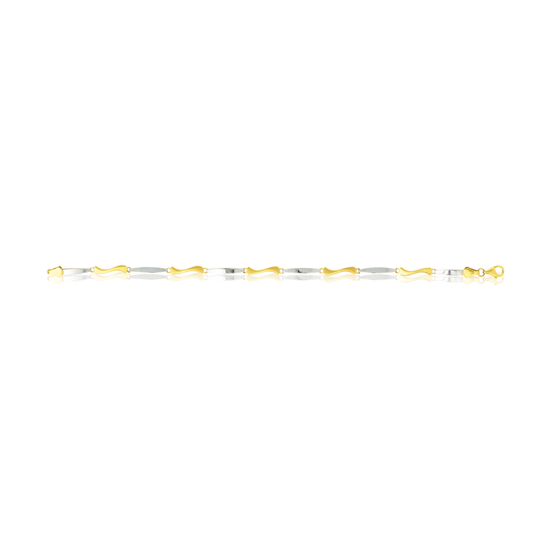 Bracelet de Créateur motif vague, en Or Jaune et Or Blanc - 750/000.  Qu'il soit classique ou fantaisiste, le bracelet saura sans conteste faire plaisir.    CARACTERISTIQUES :  Longueur (cm) : 19 Largeur (mm) : 2.6 Poids (gr) : 3.99 Matière : Or 18 Carats - 750/000 19258 