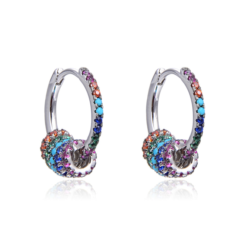 Boucles d'oreilles créoles, rhodiées ou rosées, serties de zirconiums multicolores, en Argent - 925/000.  Les créoles, véritables accessoires de mode intemporels, ajoutent une touche d'élégance à n'importe quelle tenue.  CARACTERISTIQUES :  Poids (gr) : 3.20 Matière : Argent - 925/000  19862 - 20488