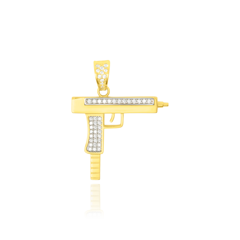 Pendentif en forme d'uzi serti de zirconium en Or Jaune et Or Blanc 18 Carats - 750/000.     CARACTERISTIQUES :  Poids (gr) : 4.40 Dimensions H x l (mm) : 27.5 x 31.9 Matière : Or 18 Carats - 750/000 18555