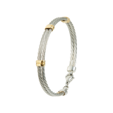Jonc pour enfant en Acier, serti de 3 inserts en Or Jaune massif 18 Carats - 750/000.  Qu'il soit classique ou fantaisiste, le bracelet saura sans conteste faire plaisir.  CARACTERISTIQUES :  Diamètre jonc (cm) : 4.70  Poids (gr) : 6.12  Matière : Or 18 Carats - 750/000  19011