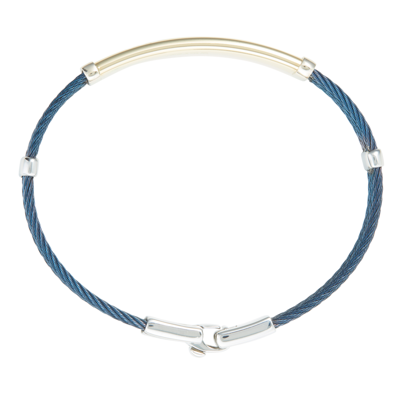 Jonc 3 câbles Acier PVD Bleu, motif central en Or Jaune et Or Blanc massif  18 Carats - 750/000.  Qu'il soit classique ou fantaisiste, le bracelet saura sans conteste faire plaisir.  Possibilité de gravure personnalisée.   CARACTERISTIQUES :  Epaisseur câble (mm) : 2.00 Diamètre jonc (cm) : 6.50 Couleur câble : PVD Bleu Poids d'or (gr) : 4.40 Matière : Acier et Or 18 Carats - 750/000 19546