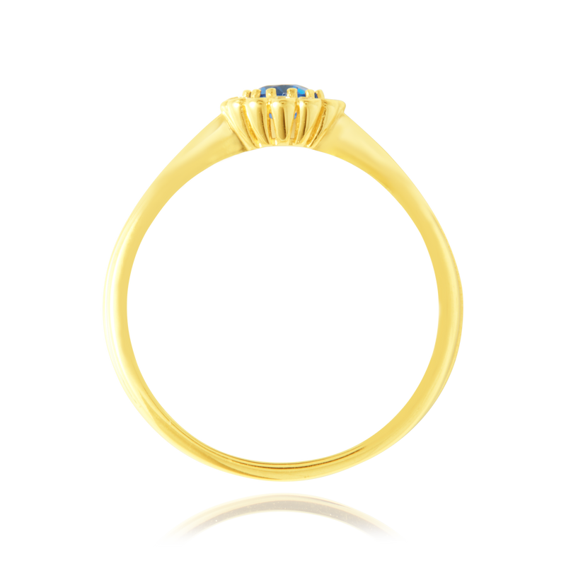 Solitaire rond serti d'un zirconium central bleu, couronné de zirconiums en forme de fleur, en Or Jaune 18 carats 750/000   CARACTERISTIQUES :  Motif central (mm) : 7.0 Epaisseur (mm) : 1.32 Poids (gr) : 1.66        Matière : Or 18 Carats - 750/000 20040