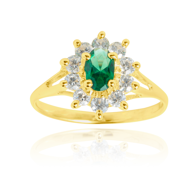 Bague marquise sertie d'un zirconium central vert et de zirconiums blancs, en Or Jaune 18 Carats - 750/000.  Cinq possibilités d'embellir vos doigts, portez une de nos bagues.   CARACTERISTIQUES :  Motif central (mm) : 10.68 x 12.20 Epaisseur (mm) : 1.90 Poids (gr) : 2.22       Matière : Or 18 Carats - 750/000 20239